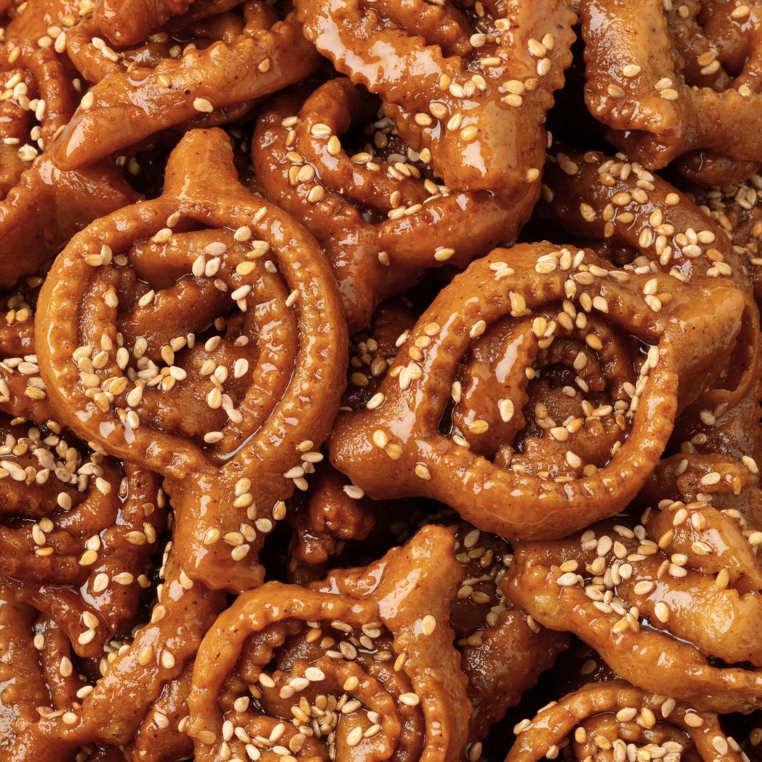Close-up of traditional Moroccan chebakia pastries, glazed with honey and sprinkled with toasted sesame seeds - Lawza Bakery - Bay Area, California