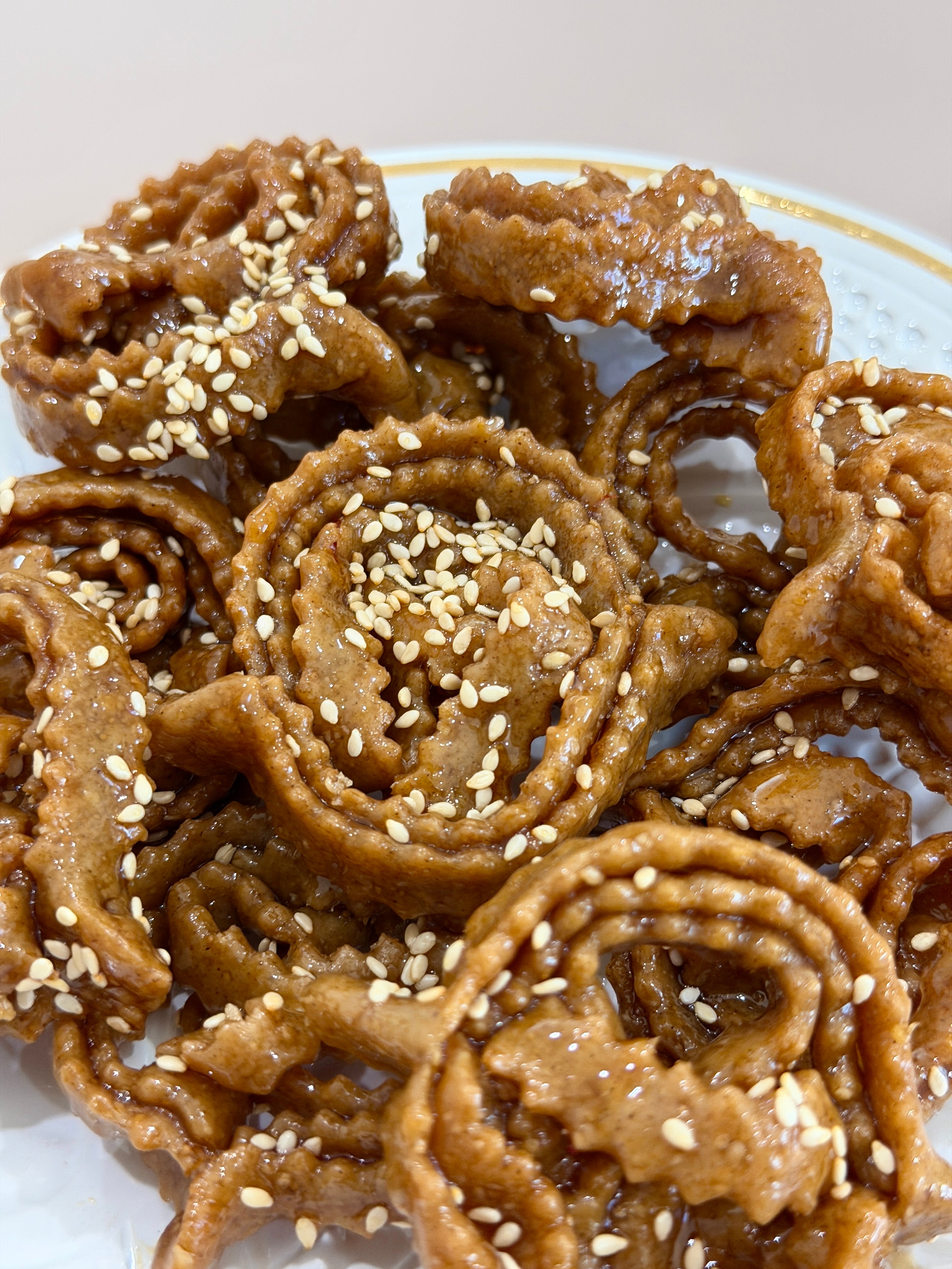 Traditional Moroccan pastry called chebakia, made with honey, sesame, saffron, anise, and cinnamon.